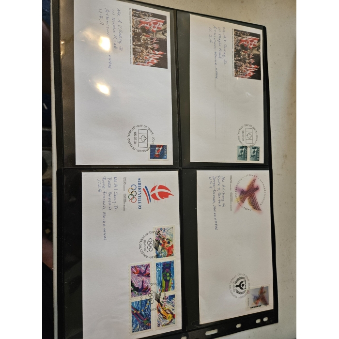 Four commemorative envelopes with stamps and postmarks.