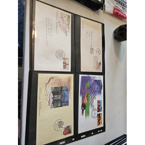 Four vintage envelopes with unique stamps displayed.