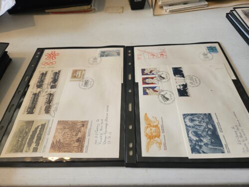 Album pages with collectible stamped envelopes.