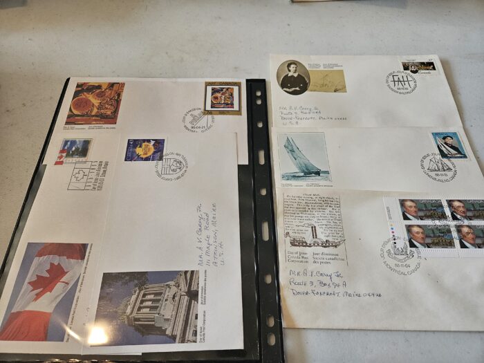 Collection of stamped envelopes in a binder sleeve.