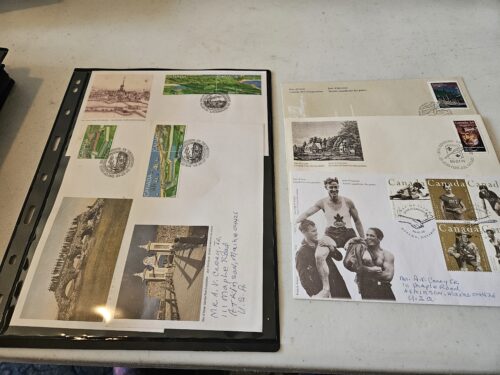 Album pages with Canadian stamps and postcards