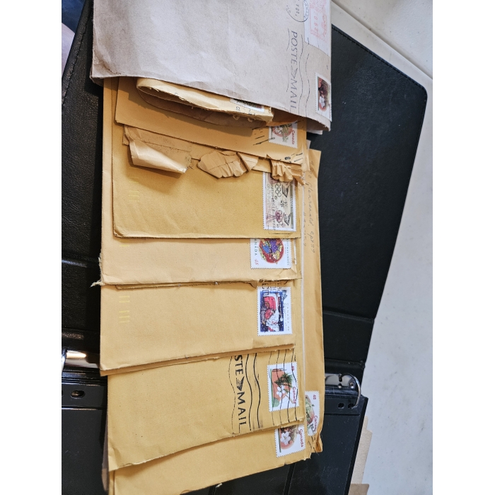 Stack of vintage airmail envelopes with stamps