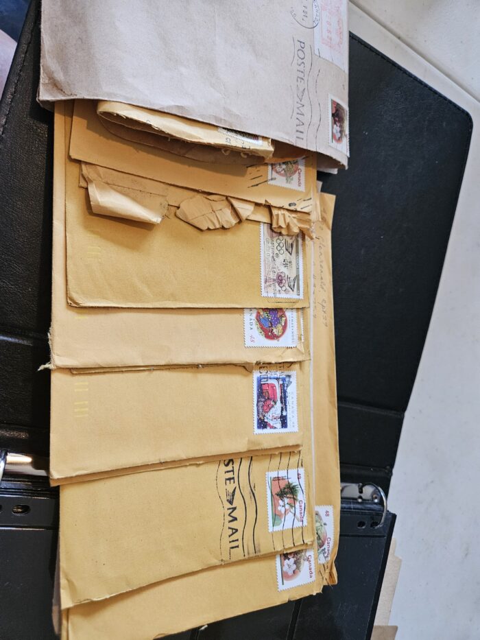 Stack of vintage airmail envelopes with stamps