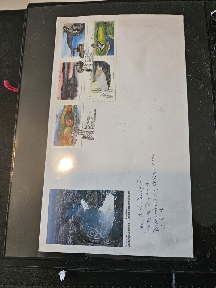 Envelope with Canadian landscape stamps and handwritten address.