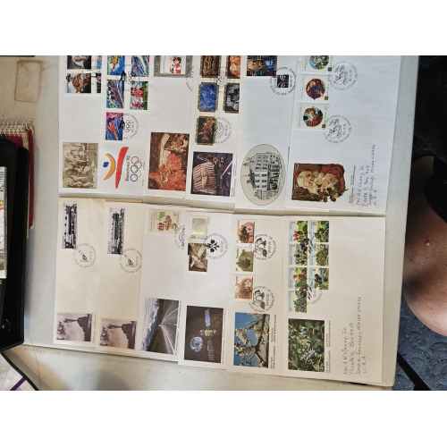 Collection of commemorative stamped envelopes.