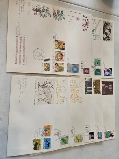 Collection of vintage commemorative envelopes and stamps.