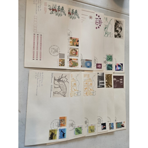 Collection of vintage commemorative envelopes and stamps.