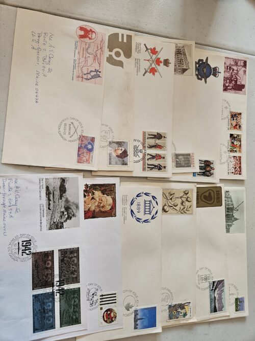 Assorted vintage postal envelopes with stamps and postmarks.