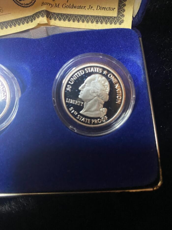 Commemorative 1976 United States quarter in display case.