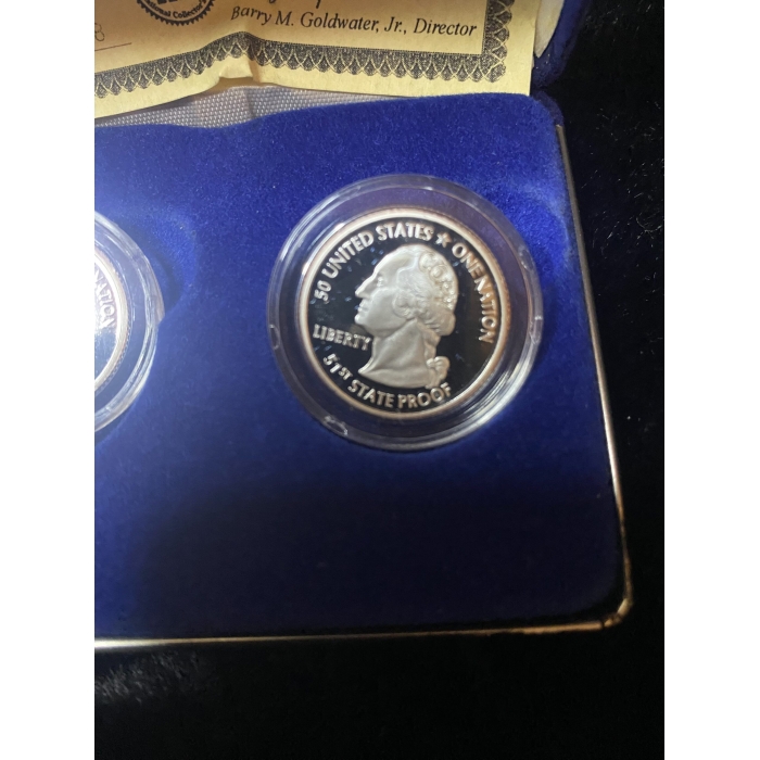 Commemorative 1976 United States quarter in display case.