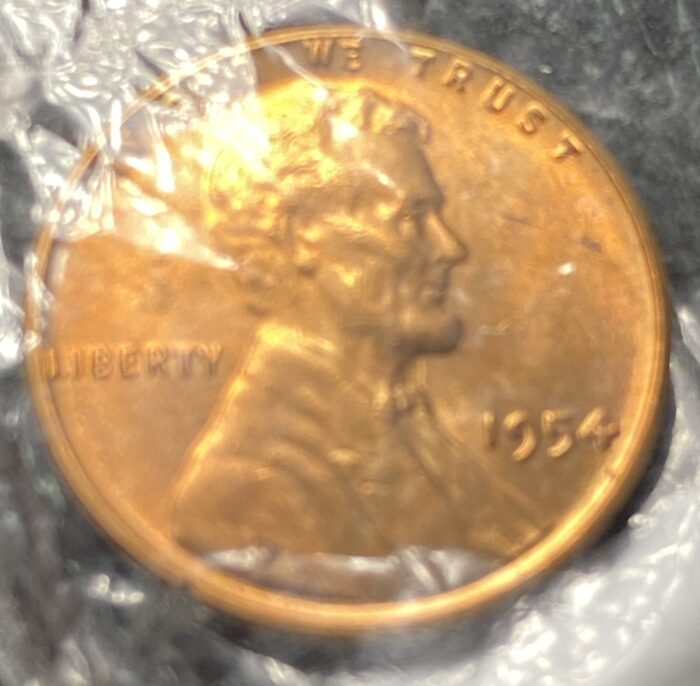 1954 Lincoln penny in plastic wrap