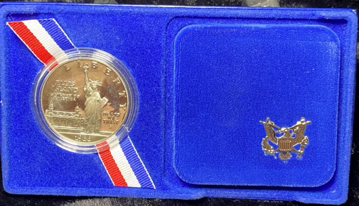 1986 Ellis Island commemorative coin in blue case.