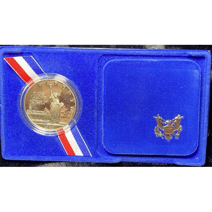 1986 Ellis Island commemorative coin in blue case.