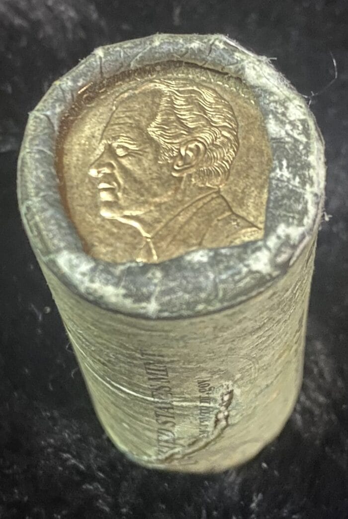 Wrapped roll of coins with visible portrait.