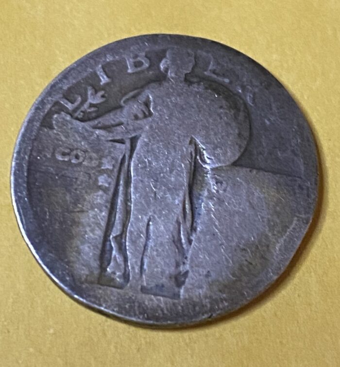 Old silver coin with detailed design