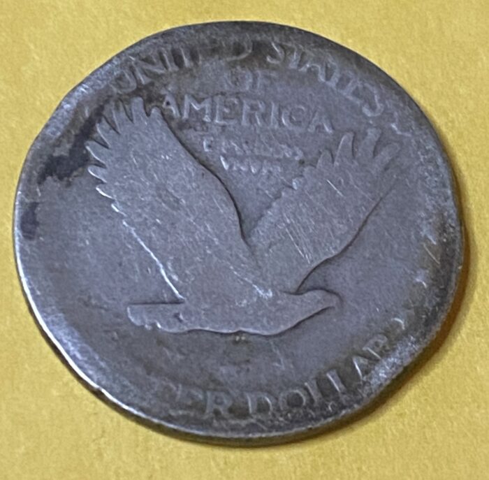 United States silver dollar with eagle design.