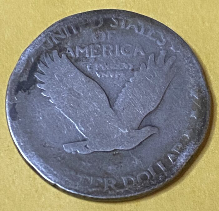 Antique US coin with eagle design.